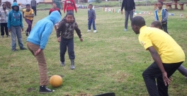 CYCWs play soccer with children at the Safe Park
