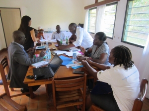 Members of the data impact team meet in Uganda