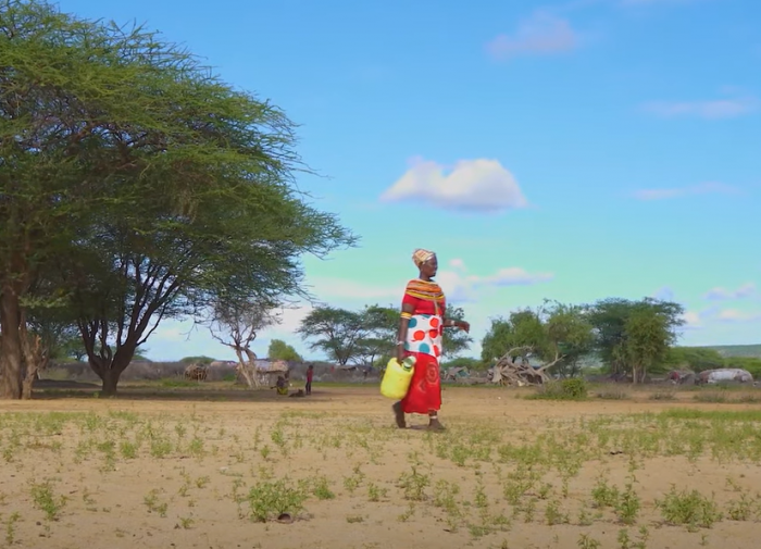 Women in Kenya carries water