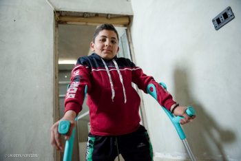 Image of a boy and crutches